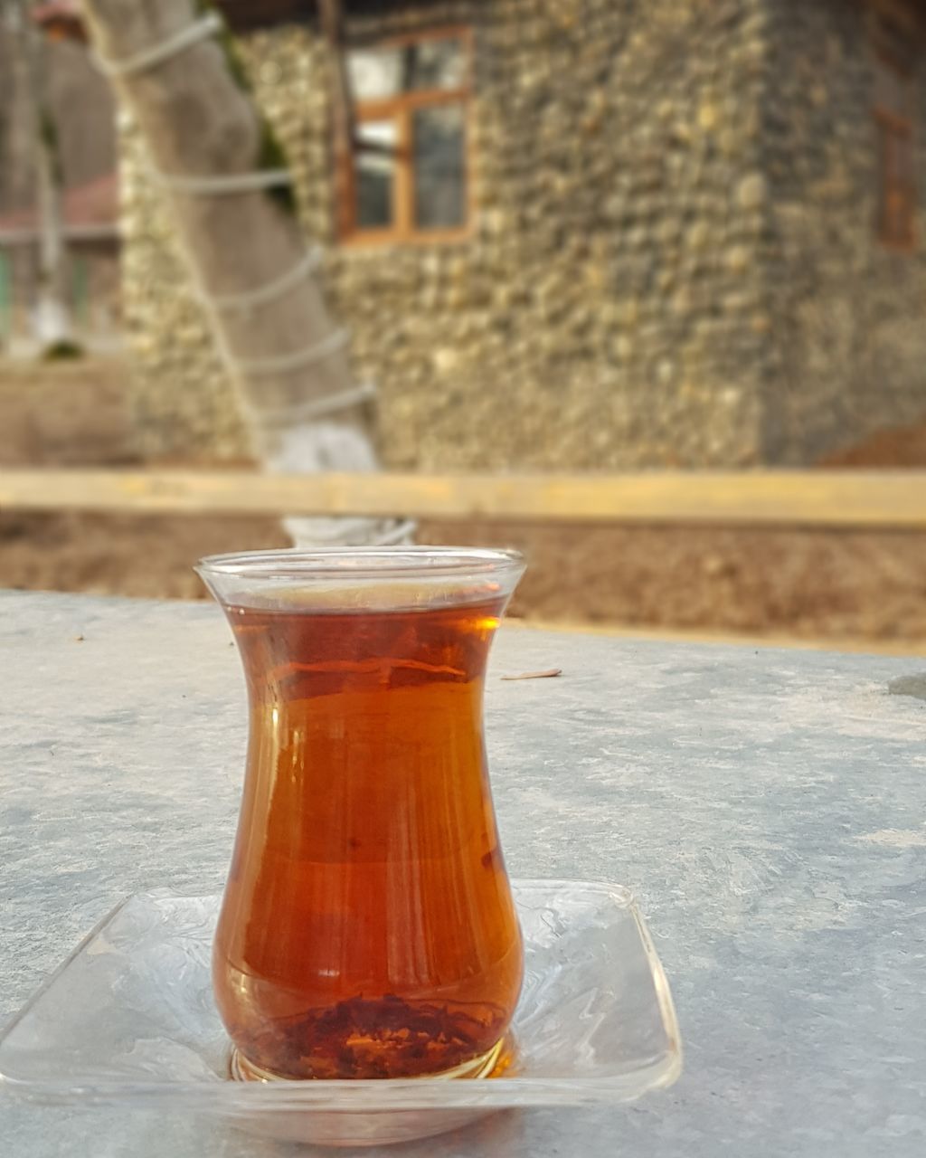 CLOSE-UP OF TEA CUP ON TABLE