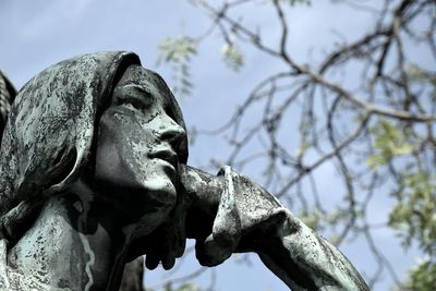 Low angle view of statue against sky