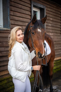 Portrait of woman riding horse