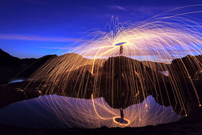 Light trails against sky at night