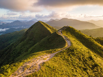 Aerial view of mountain range against sky