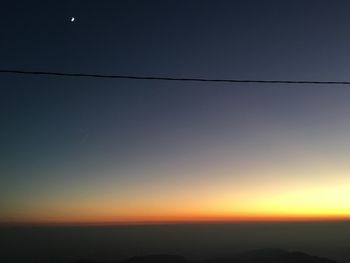 Scenic view of silhouette landscape against clear sky during sunset