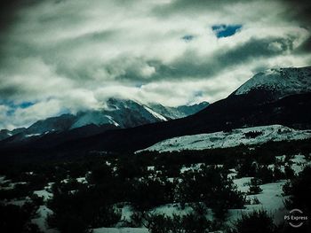 Scenic view of snowcapped mountains against sky