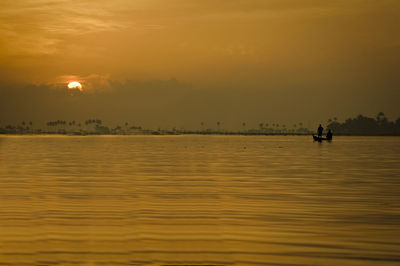 Scenic view of sea at sunset
