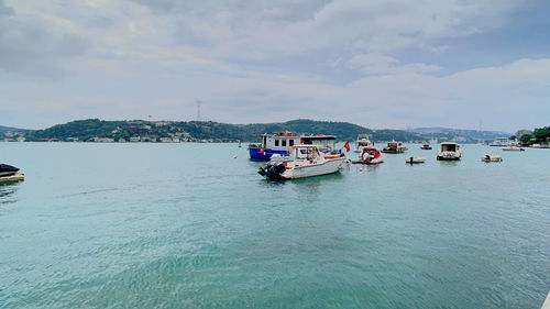 Boats in sea against sky