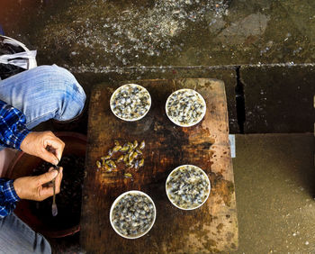 Man cleaning shells