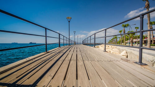 Pier over sea against sky