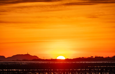 Scenic view of silhouette landscape against romantic sky at sunset