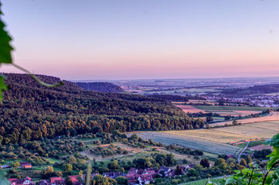 High angle view of field against sky during sunset