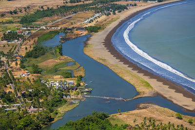 High angle view of street amidst trees in city
