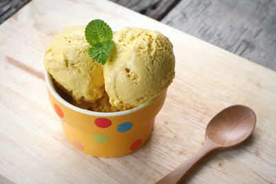 Close-up of ice cream in disposable cup on table