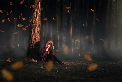 Woman in forest at night