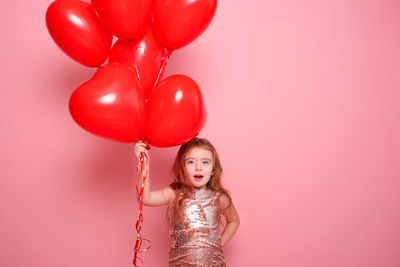 Portrait of cute girl with balloons