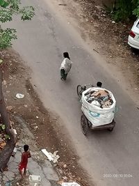 High angle view of people on street during rainy season