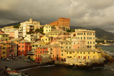 Buildings against cloudy sky
