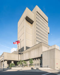 Low angle view of building against blue sky