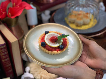Close-up of hand holding ice cream