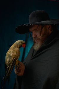 Side view of man looking at zoo