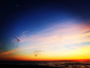 Scenic view of sea against sky at sunset