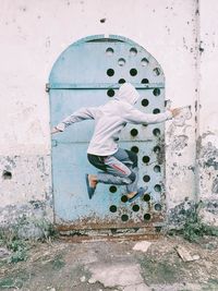 Rear view of man on wall