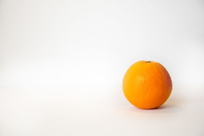 Close-up of orange on white background