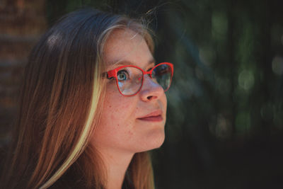 Close-up of young woman with eyeglasses