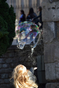 Rear view of woman at bubbles