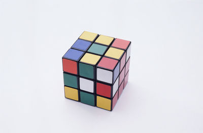 High angle view of multi colored pencils on white background