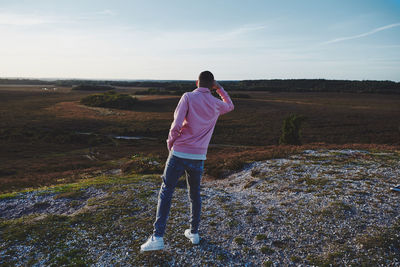 Rear view of man standing on land