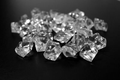 Close-up of diamonds on table