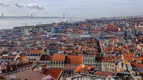 Aerial roofs view of lisbon city skyline in sunrise time, travel portugal