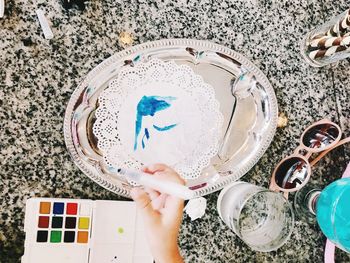 High angle view of person preparing food on table