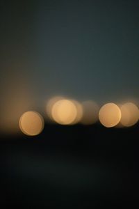 Defocused image of illuminated lights at night