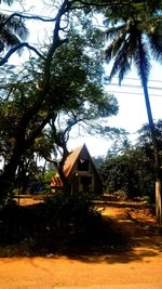 Houses on field against sky