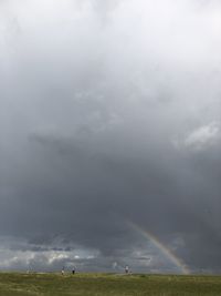 Scenic view of rainbow over field