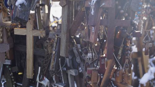 Full frame shot of sticks hanging on wood