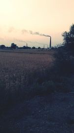 Scenic view of field against sky during sunset