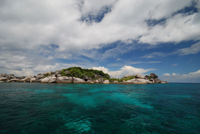 Scenic view of sea against cloudy sky