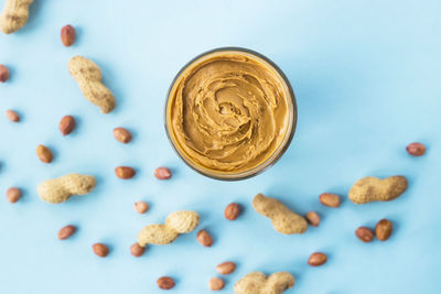 Close-up of peanut butter in glass on table