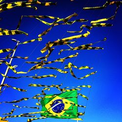 Low angle view of tree against blue sky