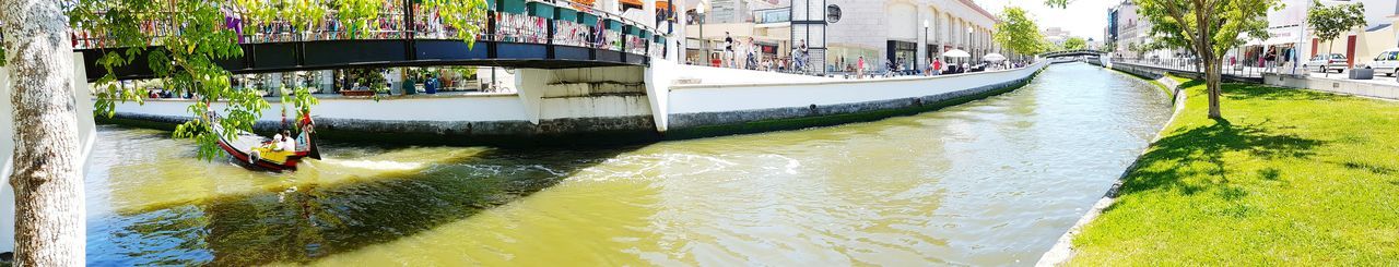 Boats in canal along buildings