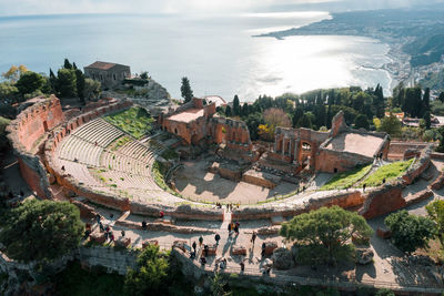 Aerial drone shot of the ancient greek theatre of taormina, theatre seen from above