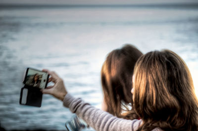 Young woman using smart phone