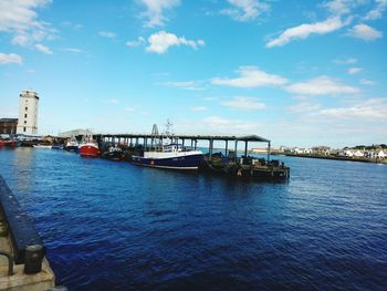 Bridge over river against blue sky