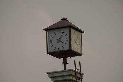 Low angle view of clock tower against sky