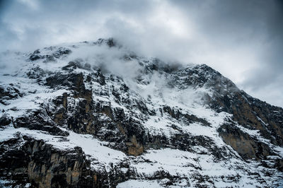 Scenic view of snow covered mountains against sky