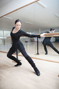 Low section of woman exercising in gym