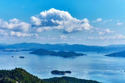 Scenic view of sea and islands against sky