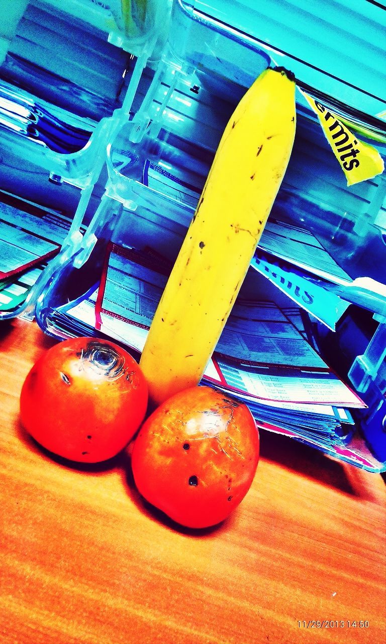 indoors, still life, table, yellow, orange color, wood - material, high angle view, close-up, no people, low angle view, red, blue, single object, wooden, architecture, multi colored, home interior, built structure, food and drink, chair