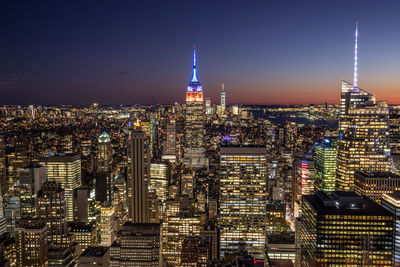 Illuminated buildings in city at night